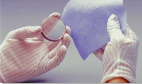 Wipes lens in hand.jpg